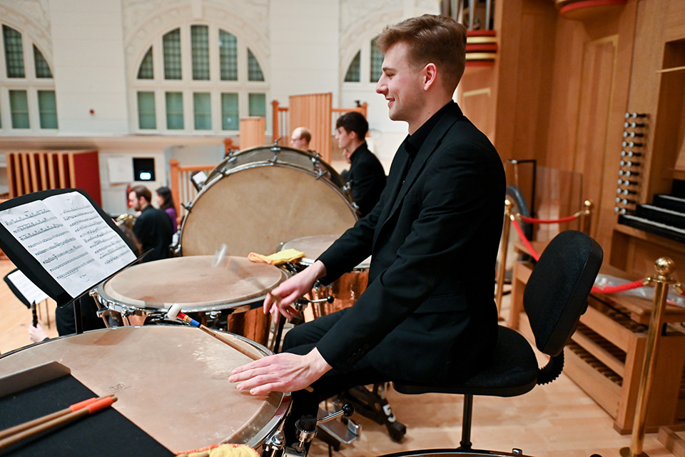 Student playing timpani in the Amaryllis Fleming Concert Hall